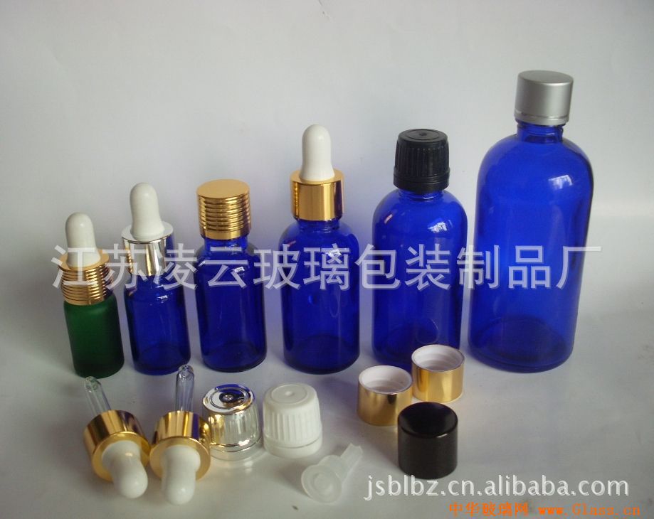 100ml蓝色精油瓶,100ml蓝色玻璃瓶,化妆品瓶,化妆品包装,滴管瓶,大头盖,滚丝金盖,生产厂家:江苏凌云玻璃包装制品厂,江苏凌云日化包装有限公司