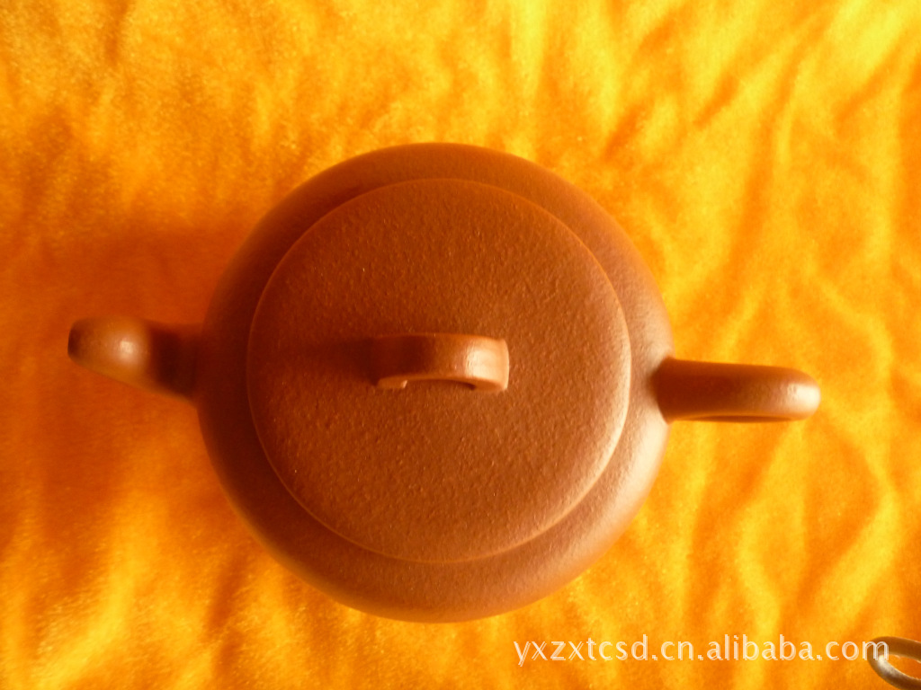 【紫砂壶 宜兴市丁蜀镇周兴陶瓷店提供】