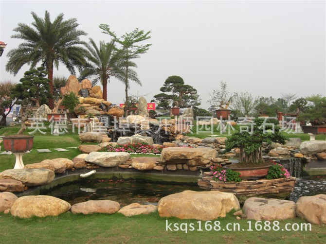 专业设计、制造大小黄腊石假山、黄蜡石鱼池水景