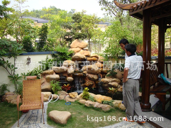 专业设计、制造大小黄腊石假山、黄蜡石鱼池水景