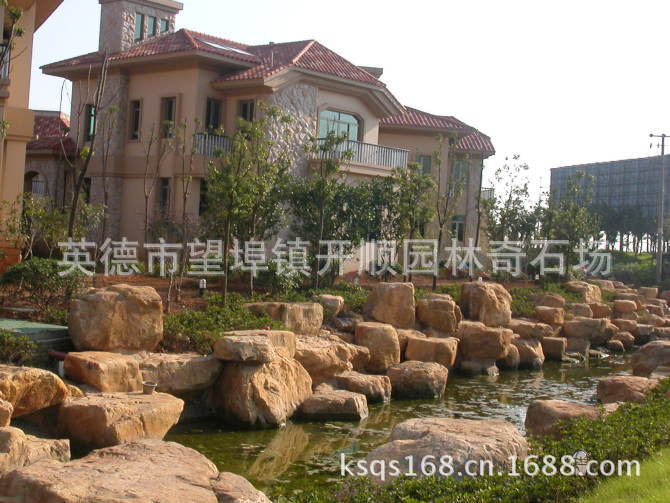 专业设计、制造大小黄腊石假山、黄蜡石鱼池水景